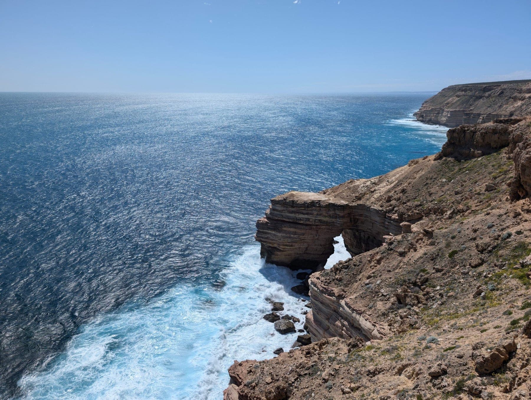 Ocean waves breaking below the cliffs at Kalbarri