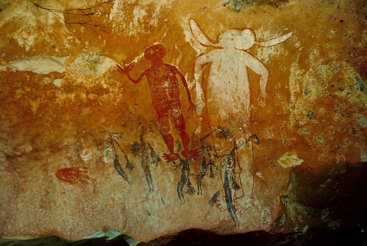 Guests viewing a Wandjina rock art gallery on the Mitchell Plateau
