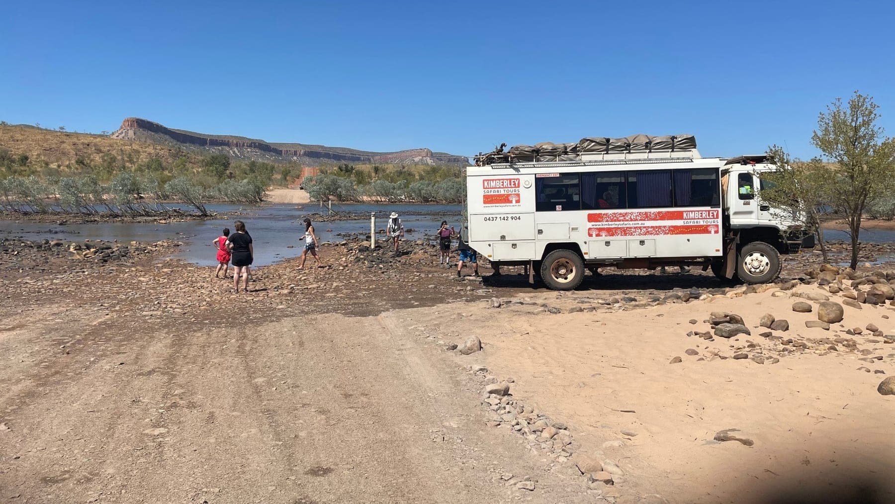 The tour coach crossing the Pentecost River
